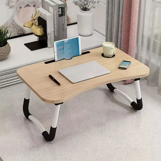 طاولة قابلة للطي بتصميم بسيط مع أدراج لاستخدامها مع الحواسيب المحمولة، وكطاولة جانبية للسرير.
